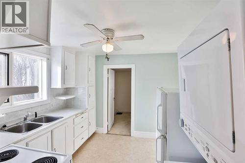 236 N 100 W, Raymond, AB - Indoor Photo Showing Kitchen With Double Sink