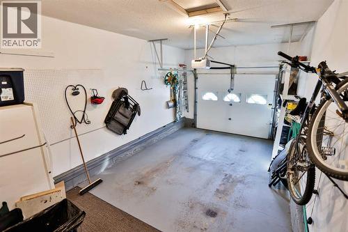2, 135 Jerry Potts Boulevard W, Lethbridge, AB - Indoor Photo Showing Garage