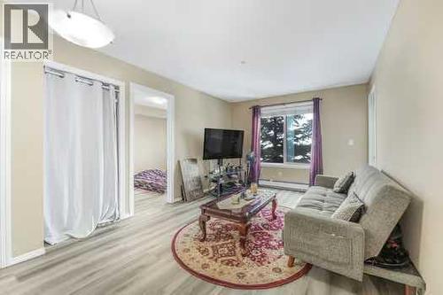 215, 355 Taralake Way Ne, Calgary, AB - Indoor Photo Showing Living Room