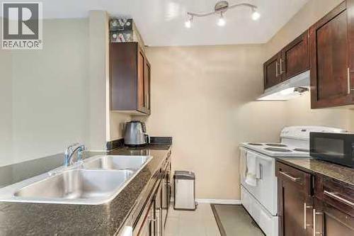 215, 355 Taralake Way Ne, Calgary, AB - Indoor Photo Showing Kitchen With Double Sink