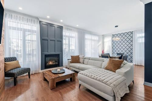 Living room - 55 Rue De Lavours, Terrebonne (Terrebonne), QC - Indoor Photo Showing Living Room With Fireplace
