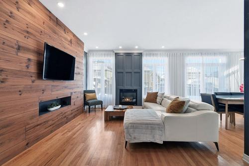 Living room - 55 Rue De Lavours, Terrebonne (Terrebonne), QC - Indoor Photo Showing Living Room With Fireplace