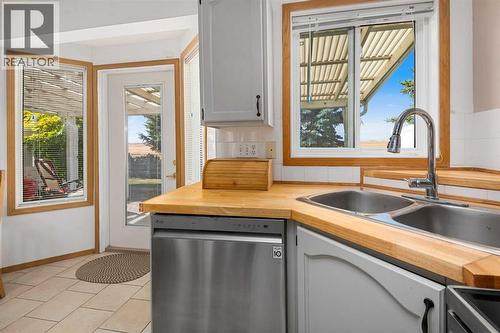 17, 1200 Milt Ford Lane, Carstairs, AB - Indoor Photo Showing Kitchen With Double Sink