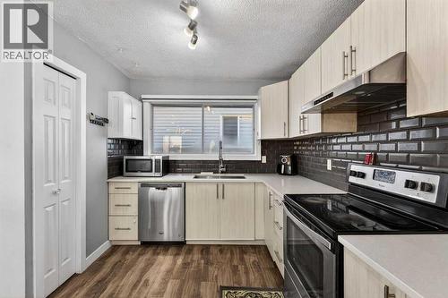 8 Malvern Crescent Ne, Calgary, AB - Indoor Photo Showing Kitchen With Stainless Steel Kitchen