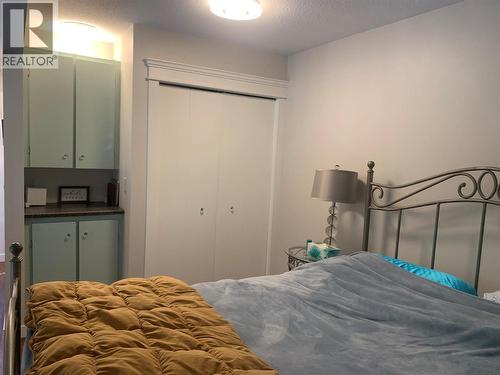 Built in cabinet and closet in loft - 3155 Gordon Drive Unit# 407, Kelowna, BC - Indoor Photo Showing Bedroom