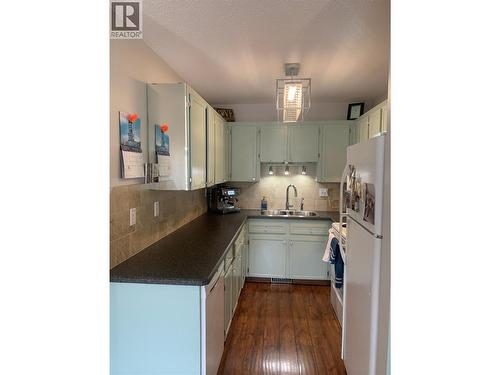Kitchen when owner was living there - 3155 Gordon Drive Unit# 407, Kelowna, BC - Indoor Photo Showing Kitchen With Double Sink