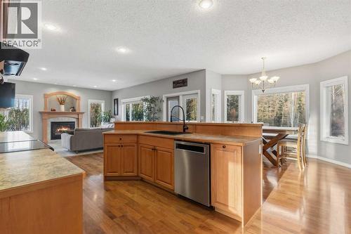 26 Park Point, Whitecourt, AB - Indoor Photo Showing Kitchen With Fireplace