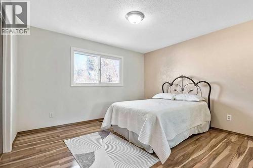 107 Lock Crescent, Okotoks, AB - Indoor Photo Showing Bedroom