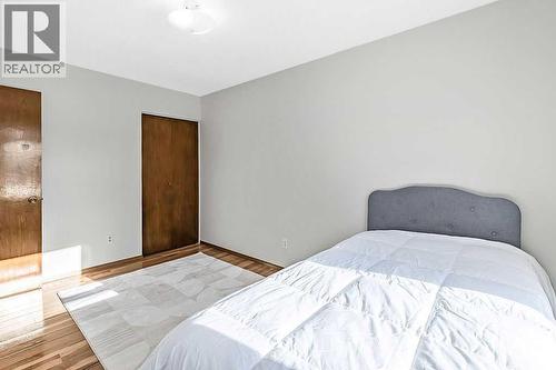 107 Lock Crescent, Okotoks, AB - Indoor Photo Showing Bedroom