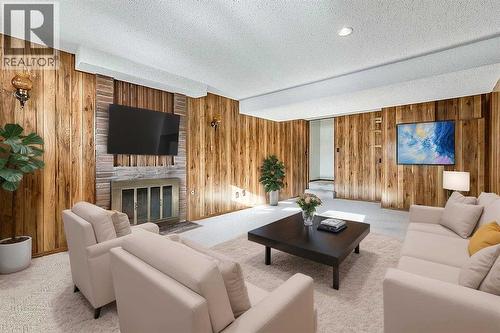 107 Lock Crescent, Okotoks, AB - Indoor Photo Showing Living Room With Fireplace