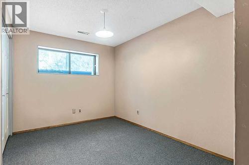 107 Lock Crescent, Okotoks, AB - Indoor Photo Showing Other Room