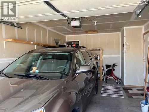 901 Nativity Bay, Rural Rocky View County, AB - Indoor Photo Showing Garage