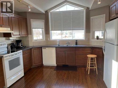 901 Nativity Bay, Rural Rocky View County, AB - Indoor Photo Showing Kitchen With Double Sink