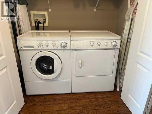 901 Nativity Bay, Rural Rocky View County, AB - Indoor Photo Showing Laundry Room