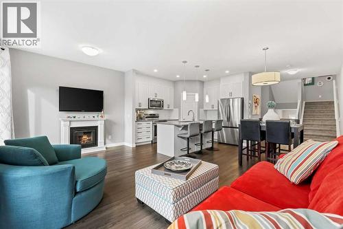 3 Sage Bluff Heights Nw, Calgary, AB - Indoor Photo Showing Living Room With Fireplace