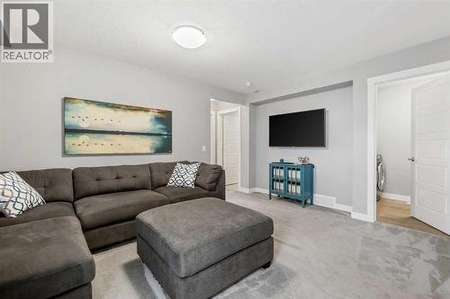 3 Sage Bluff Heights Nw, Calgary, AB - Indoor Photo Showing Living Room With Fireplace