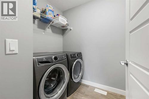 3 Sage Bluff Heights Nw, Calgary, AB - Indoor Photo Showing Laundry Room