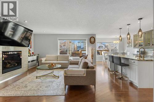 109 Copperfield Common Se, Calgary, AB - Indoor Photo Showing Living Room With Fireplace