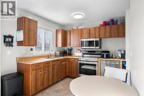 43 Applewood Drive Se, Calgary, AB - Indoor Photo Showing Kitchen With Double Sink