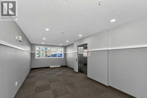 1207, 33 Carringham Gate Nw, Calgary, AB - Indoor Photo Showing Other Room