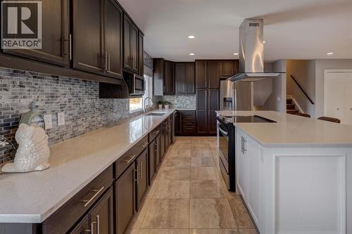 413 Albert Street Se, Airdrie, AB - Indoor Photo Showing Kitchen With Double Sink With Upgraded Kitchen