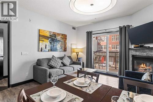 205 Rot. A, 901 Mountain Street, Canmore, AB - Indoor Photo Showing Living Room With Fireplace
