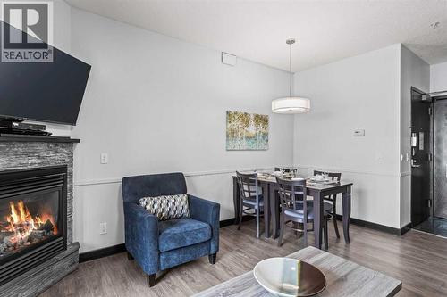 205 Rot. A, 901 Mountain Street, Canmore, AB - Indoor With Fireplace