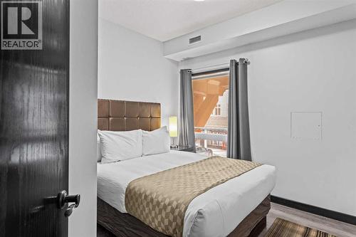 205 Rot. A, 901 Mountain Street, Canmore, AB - Indoor Photo Showing Bedroom