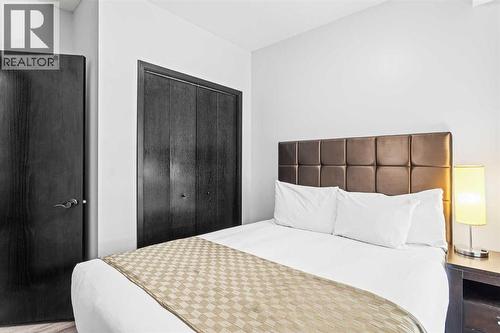 205 Rot. A, 901 Mountain Street, Canmore, AB - Indoor Photo Showing Bedroom