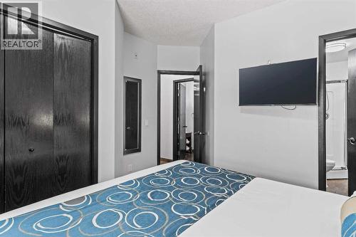 205 Rot. A, 901 Mountain Street, Canmore, AB - Indoor Photo Showing Bedroom