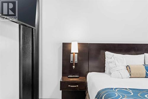 205 Rot. A, 901 Mountain Street, Canmore, AB - Indoor Photo Showing Bedroom