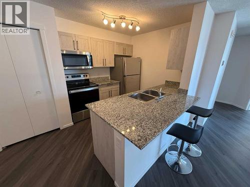 3419, 4641 128 Avenue Ne, Calgary, AB - Indoor Photo Showing Kitchen With Stainless Steel Kitchen With Double Sink