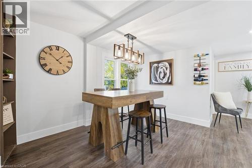 Dining room featuring dark wood finished floors and baseboards - 4255 William Street, Beamsville, ON - Indoor Photo Showing Dining Room