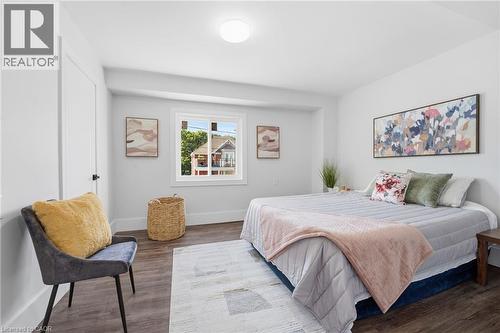 Bedroom featuring dark wood finished floors and baseboards - 4255 William Street, Beamsville, ON - Indoor Photo Showing Bedroom