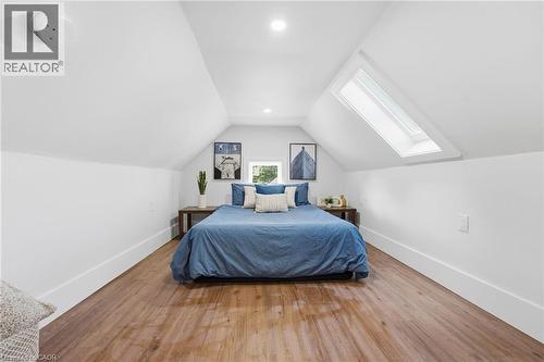 Bedroom featuring lofted ceiling, wood finished floors, a skylight, and recessed lighting - 4255 William Street, Beamsville, ON - Indoor Photo Showing Bedroom