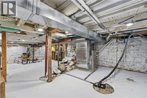 Unfinished below grade area with heating unit - 4255 William Street, Beamsville, ON - Indoor Photo Showing Basement