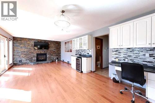 23 Springwood Drive Ne, Slave Lake, AB - Indoor With Fireplace