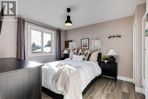 Bedroom 1 - 1205 Meadowbrook Drive Se, Airdrie, AB - Indoor Photo Showing Bedroom