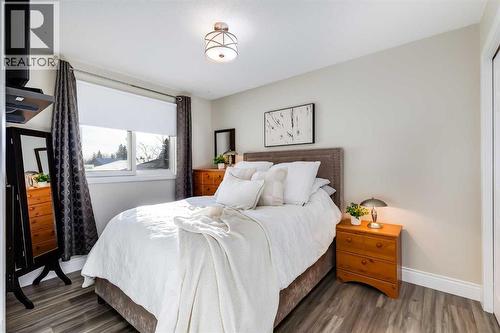 Bedroom 3 - 1205 Meadowbrook Drive Se, Airdrie, AB - Indoor Photo Showing Bedroom