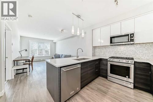 3210, 95 Burma Star Road Sw, Calgary, AB - Indoor Photo Showing Kitchen With Double Sink With Upgraded Kitchen