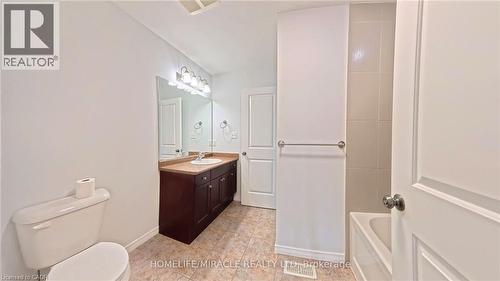 Bathroom with vanity and baseboards - 919 Zeller Crescent, Kitchener, ON - Indoor Photo Showing Bathroom