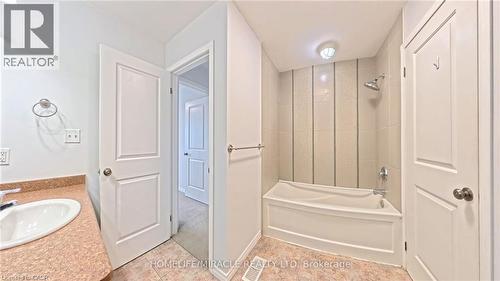 Bathroom featuring tub / shower combination and vanity - 919 Zeller Crescent, Kitchener, ON - Indoor Photo Showing Bathroom