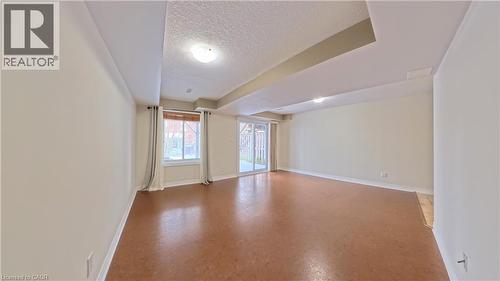 Spare room with a textured ceiling and baseboards - 919 Zeller Crescent, Kitchener, ON - Indoor Photo Showing Other Room