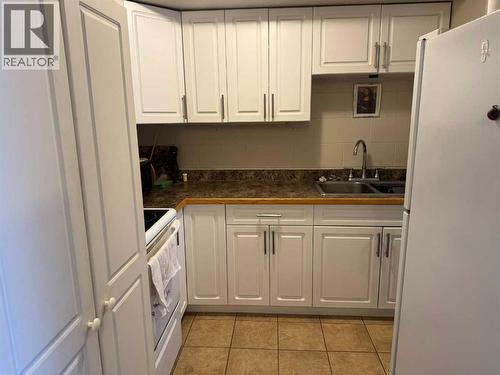 8808 96 Street, Peace River, AB - Indoor Photo Showing Kitchen With Double Sink