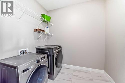 41 Shawnee Green Sw, Calgary, AB - Indoor Photo Showing Laundry Room