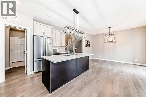 41 Shawnee Green Sw, Calgary, AB - Indoor Photo Showing Kitchen With Stainless Steel Kitchen With Upgraded Kitchen