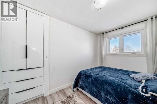 Bedroom 2 overlooks backyard - 216 Pinecrest Crescent Ne, Calgary, AB - Indoor Photo Showing Bedroom