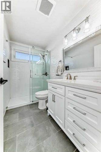 3 pc renovated main bath - 216 Pinecrest Crescent Ne, Calgary, AB - Indoor Photo Showing Bathroom