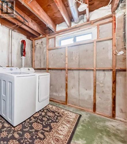 Shared Laundry in Common Area in the Basement - 216 Pinecrest Crescent Ne, Calgary, AB - Indoor Photo Showing Laundry Room