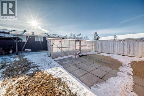 Concrete parking pad could become personal basketball court - 216 Pinecrest Crescent Ne, Calgary, AB - Outdoor